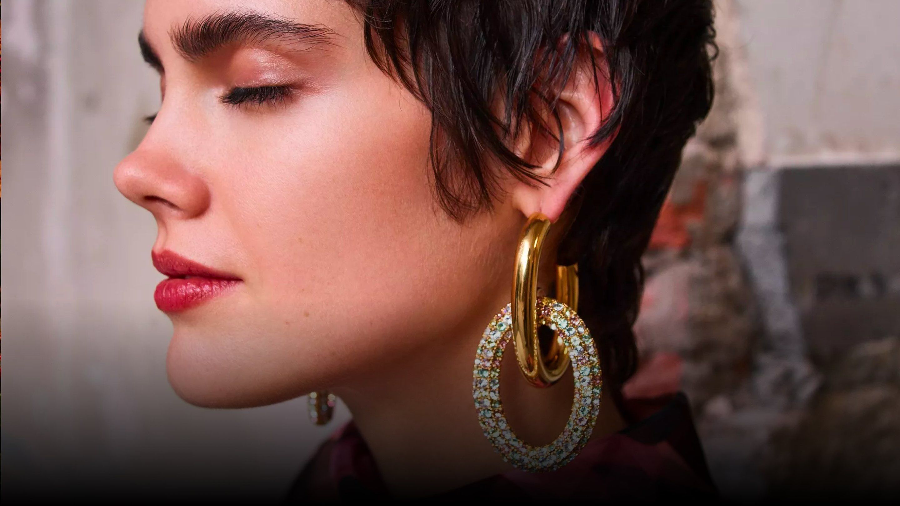 model wearing mulberry gold large hoop earrings